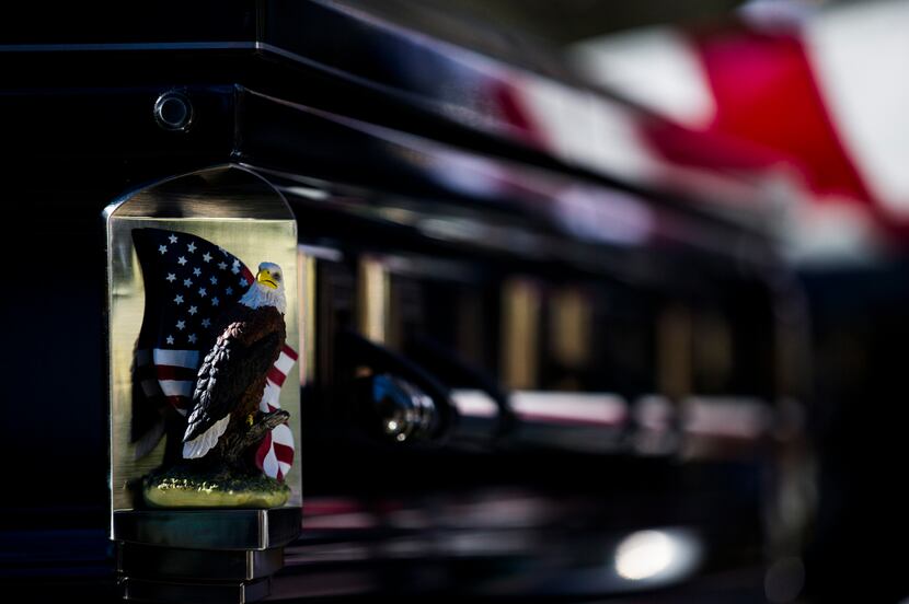 A bald eagle and an American flag are displayed on each corner of the casket of Richard...