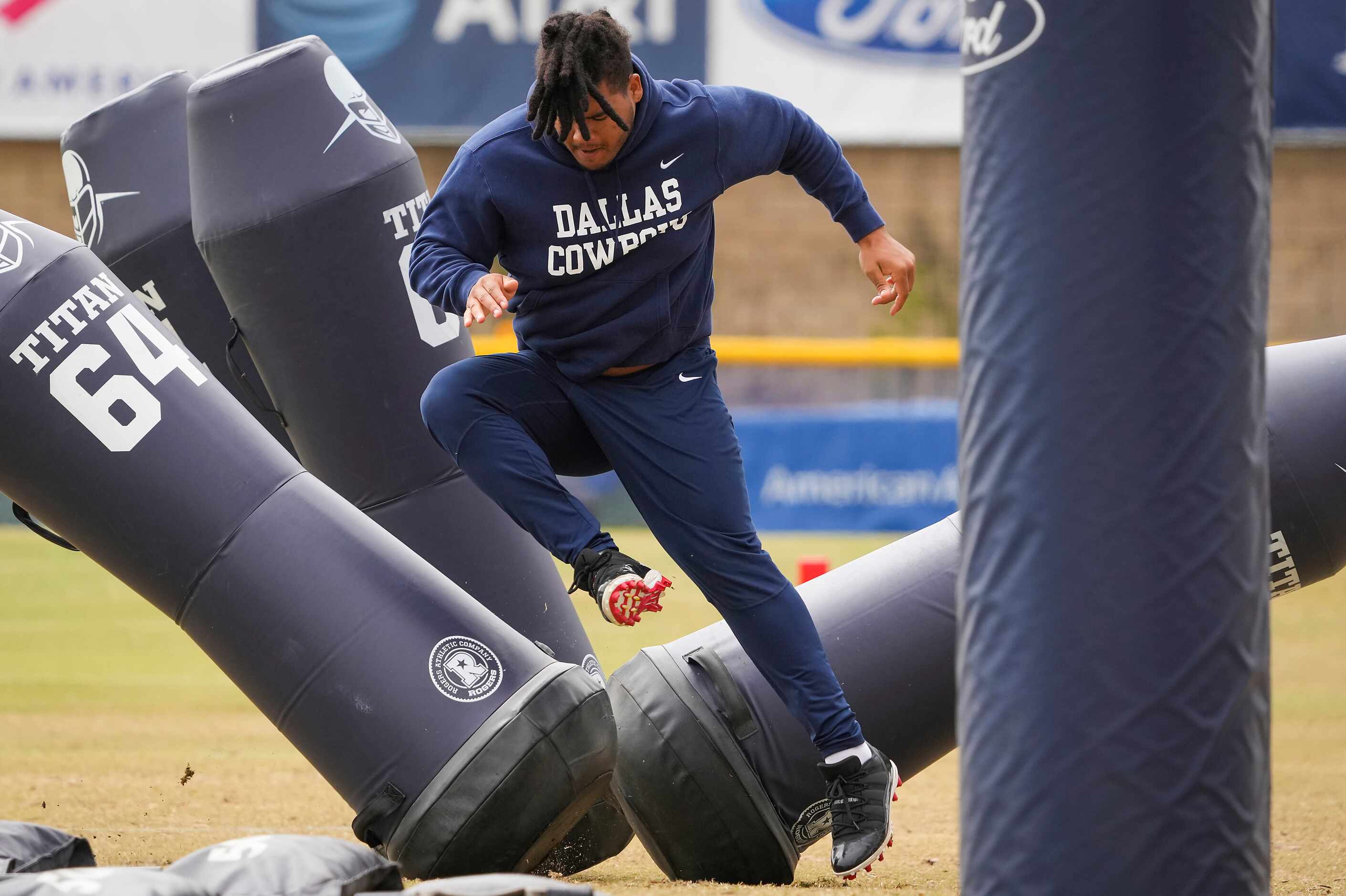 Dallas Cowboys defensive tackle Trysten Hill runs a drill during a practice at training camp...