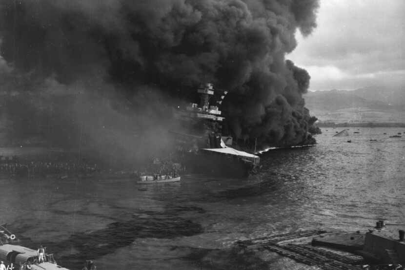 Raging fires force the crew of the battleship USS California to abandon ship during the...