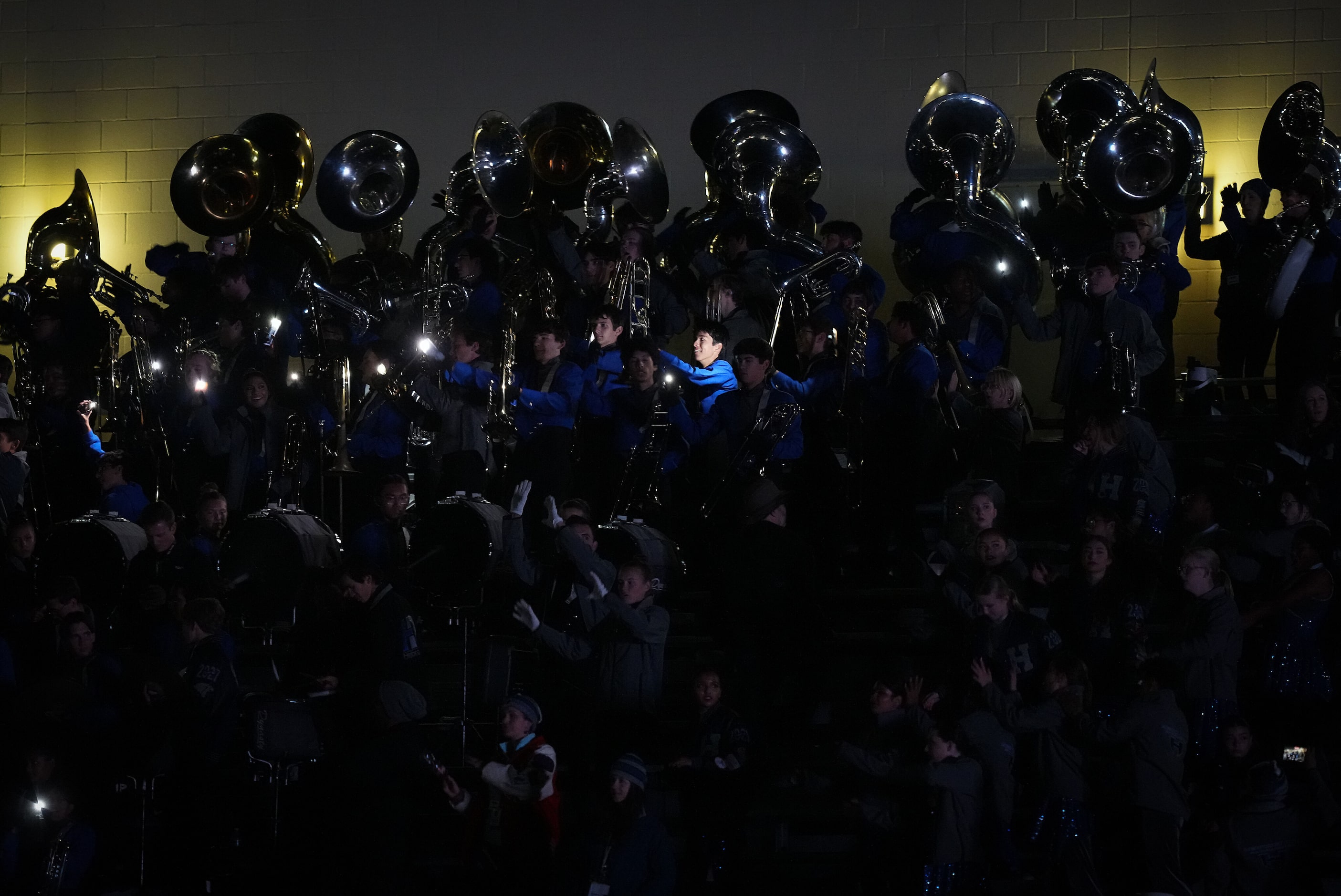 Members of the Hebron band play during delay due to the main stadium lights going out  with...