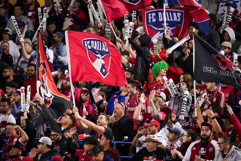 FC Dallas supporters cheer their side during the first half of an MLS playoff soccer match...