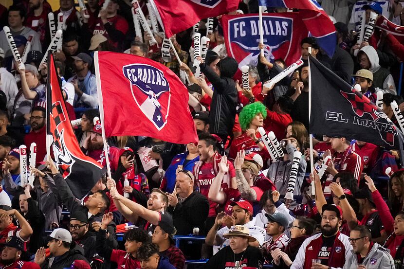 FC Dallas supporters cheer their side during the first half of an MLS playoff soccer match...