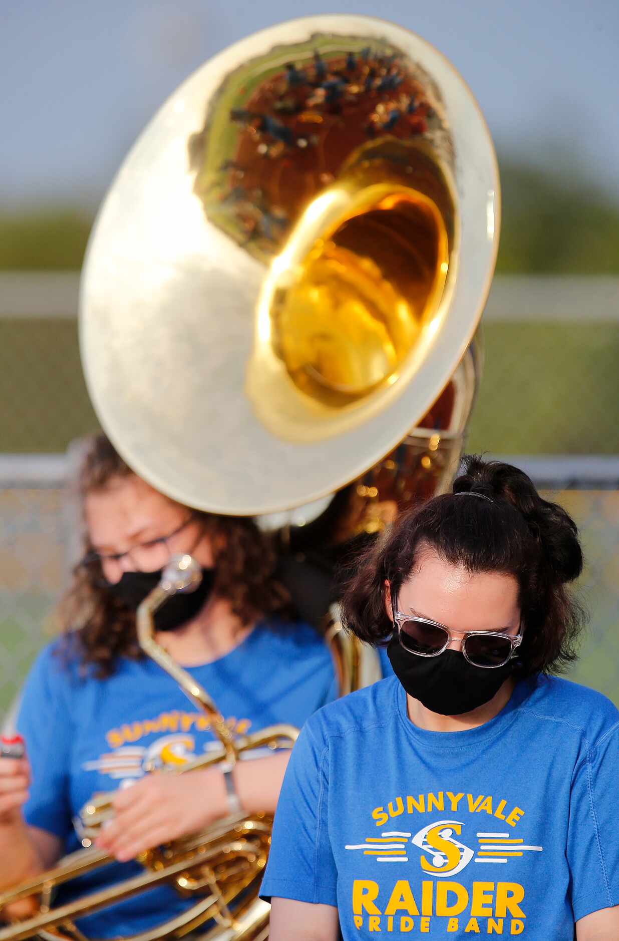 Lynsie Coning, 17, with a sousaphone, and Cadence Houghton, 17, a trumpet player, were...