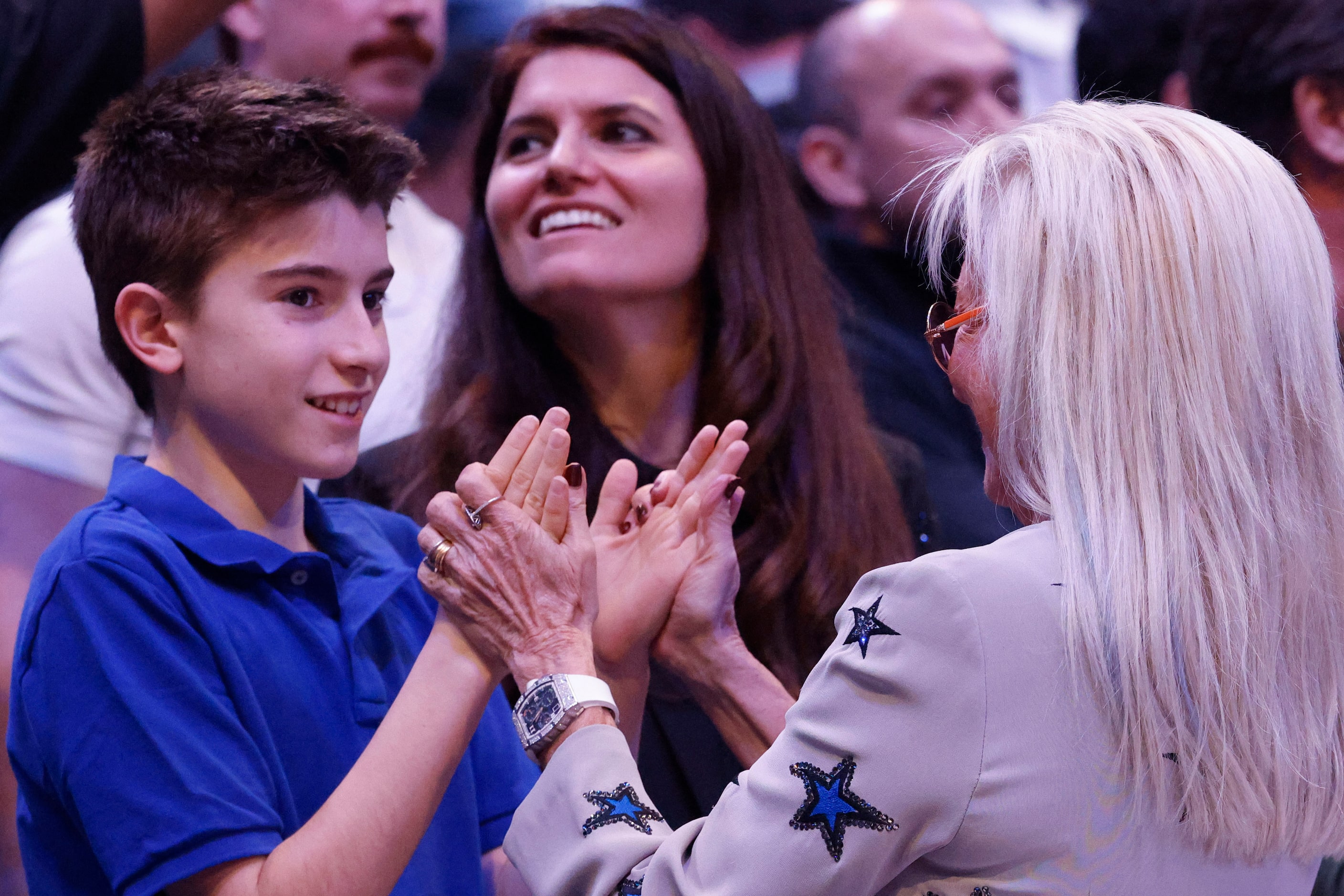 Miriam Adelson, (right) enjoys time with her family as her daughter Sivan Ochshorn  (back)...