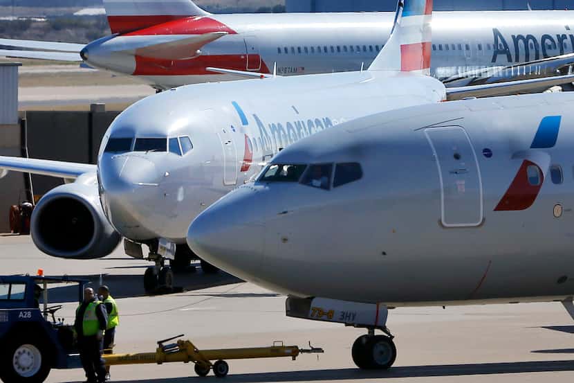 FILE photo showing American Airlines planes on the tarmac at the DFW International Airport....