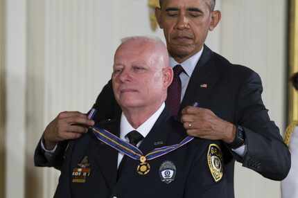 President Barack Obama awards the Medal of Valor to Garland police Officer Gregory Stevens. 
