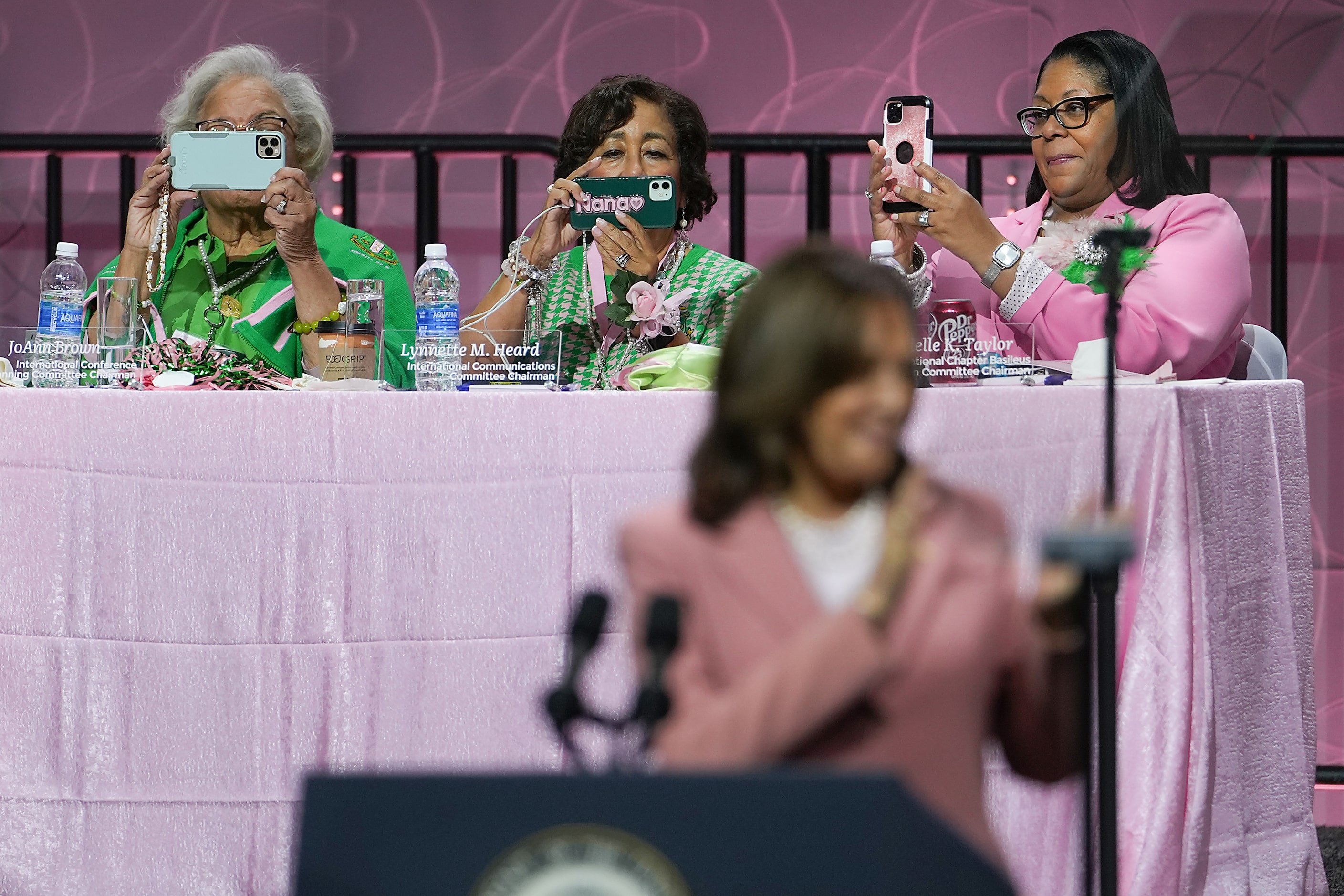 From left, JoAnne Brown, Lynnette M. Heard and Dannielle K. Taylor  train their mobile phone...