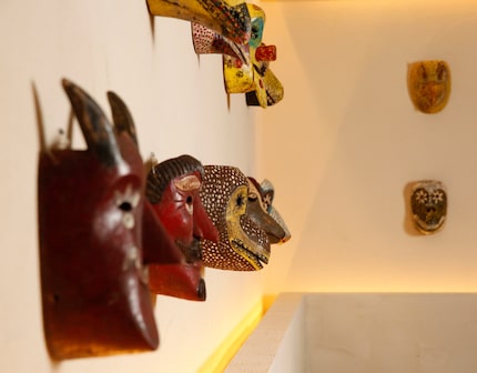 Masks hang on the wall of Jalisco Norte in Dallas on April 4, 2018.