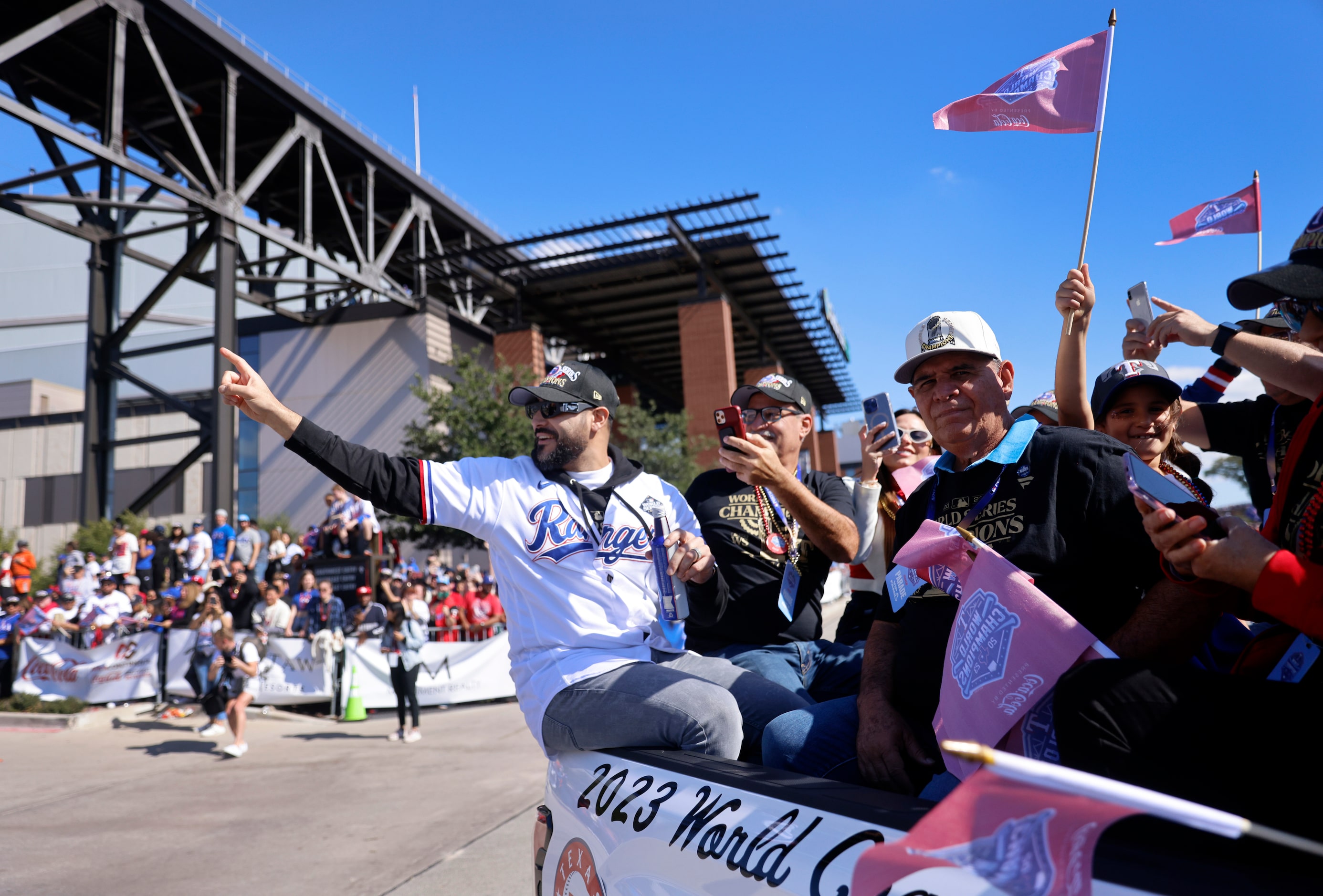 Texas Rangers pitcher Martin Perez waves to fans during the World Series Victory Parade...