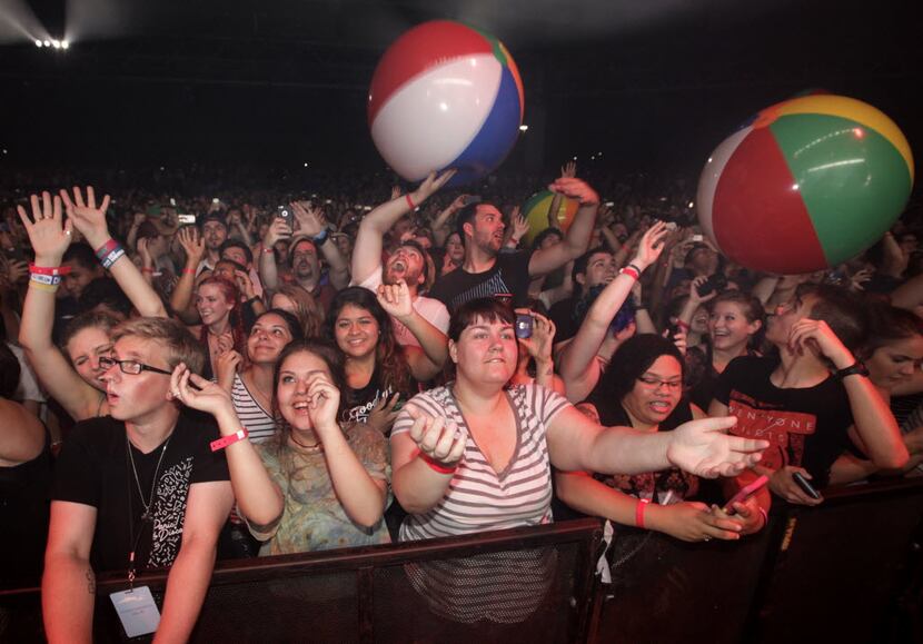 Fans cheer as the rock band Weezer performs at Gexa Energy Pavillion in Dallas, TX, on Jul....