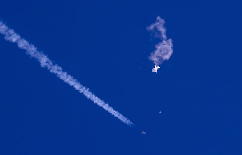 In this photo provided by Chad Fish, the remnants of a large balloon drift above the...