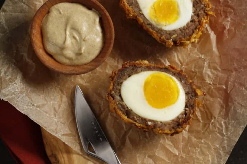 Baked Scotch Eggs with Crushed Cornflakes. Credits: Olive wood serving board from West Elm,...