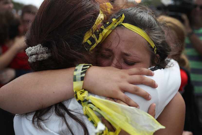 Madison Fox is hugged as the West Boca High School student joined hundreds of fellow...