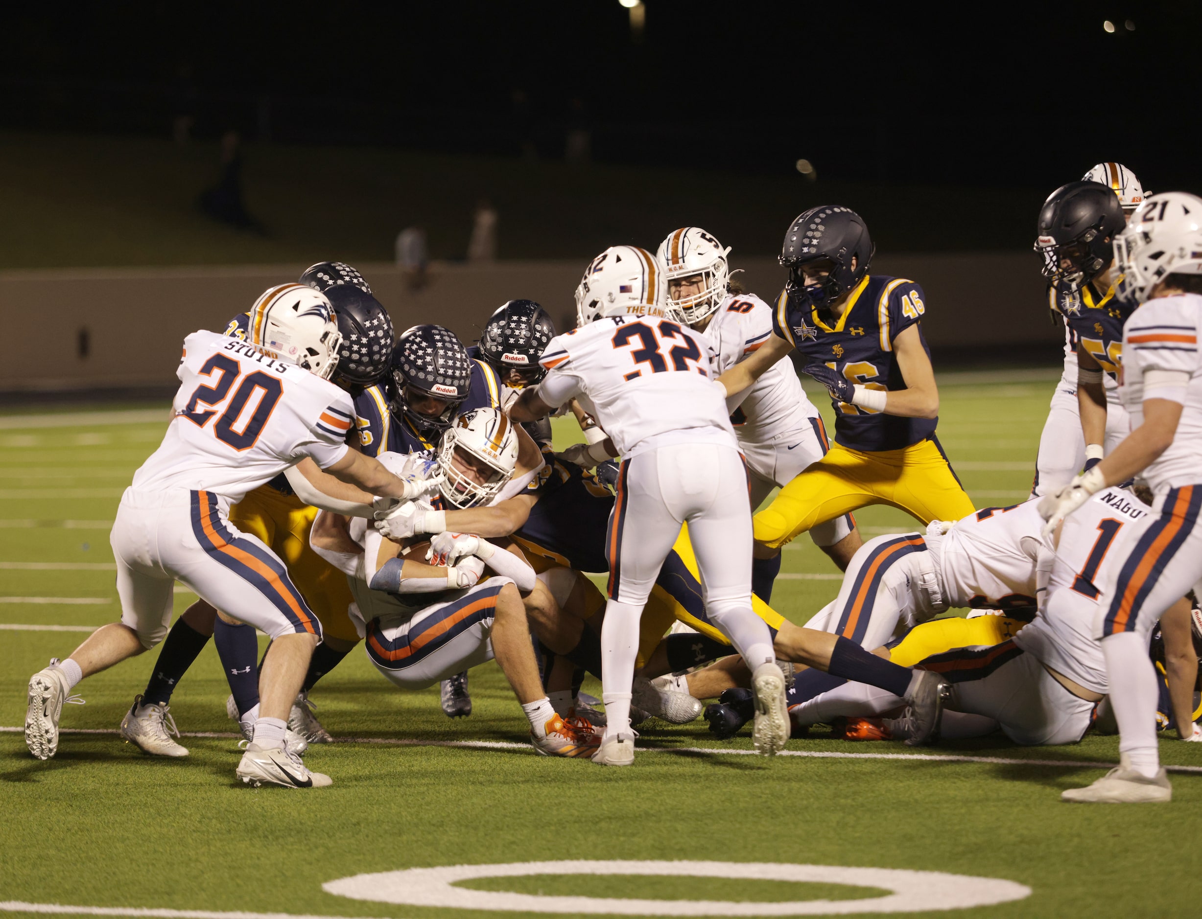 Frisco Wakeland's Grayson Myer gets taken down in a football playoff game against Highland...