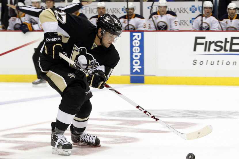 Oct 5, 2013; Pittsburgh, PA, USA; Pittsburgh Penguins center Dustin Jeffrey (17) skates into...