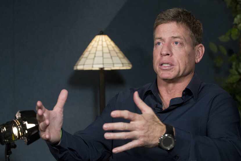 Former Dallas Cowboys quarterback Troy Aikman talks during an interview with The Associated...