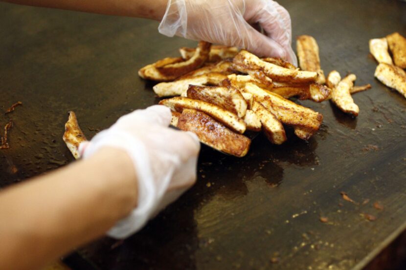 Detail shot of the fish being prepared for the grilled mahi mahi fish taco featured at Rusty...