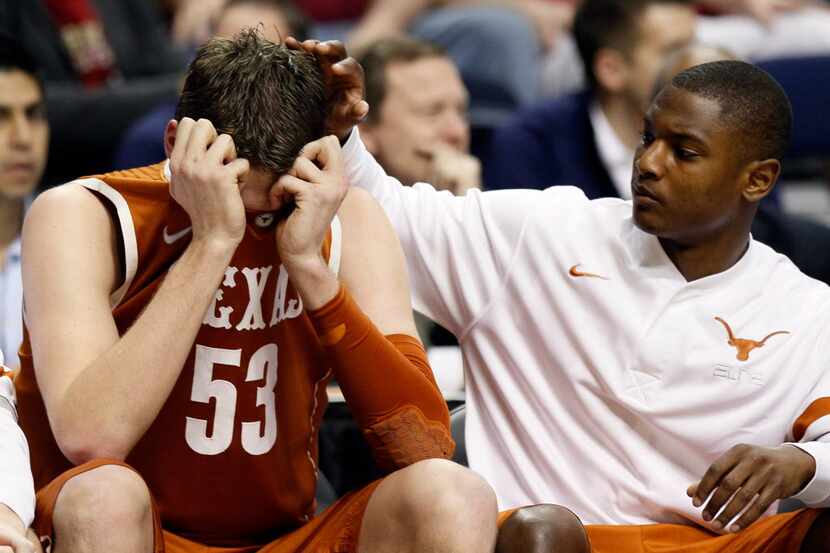 NASHVILLE, TN - MARCH 16:  Clint Chapman (L) #53 of the Texas Longhorns hides his head in...
