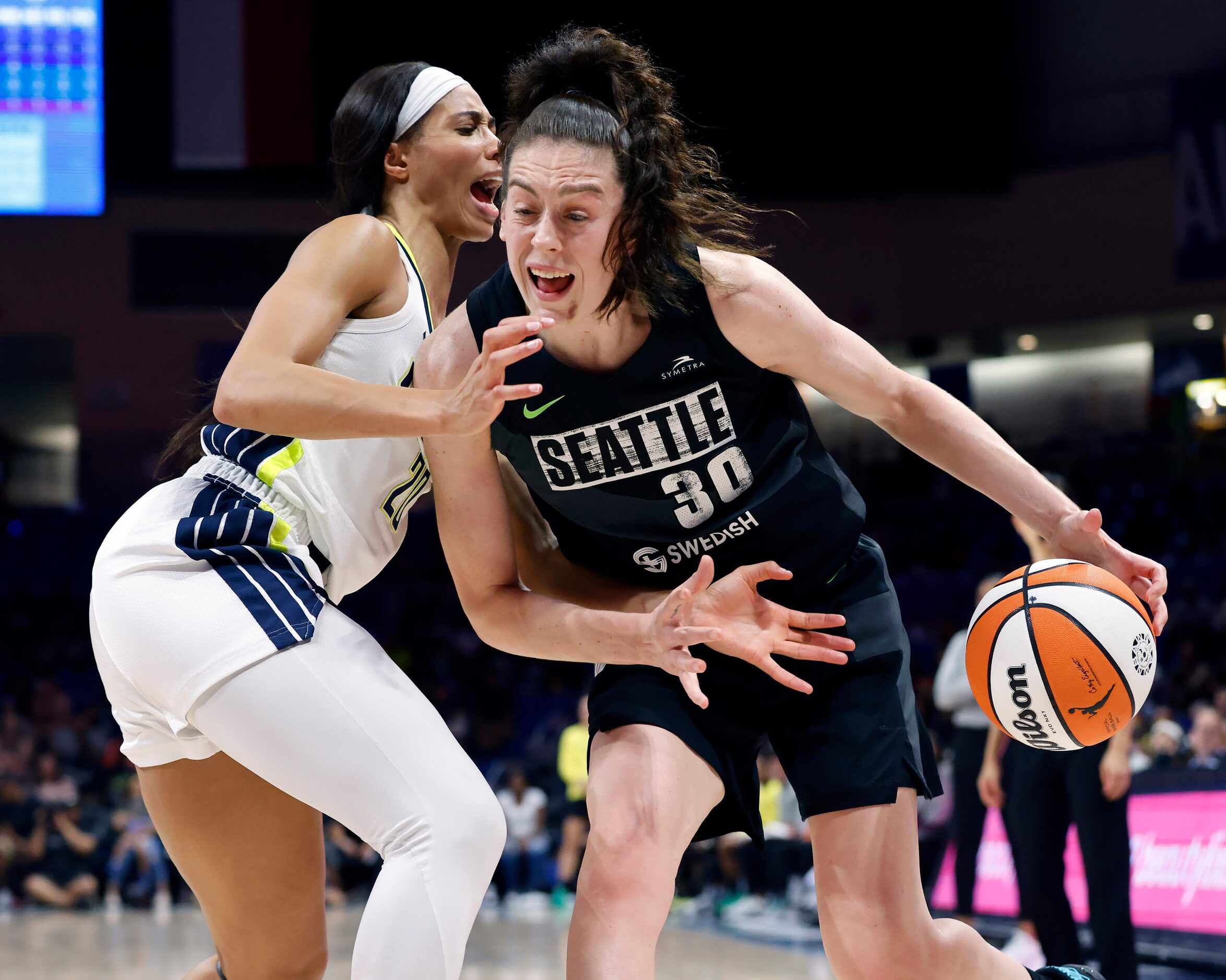 Seattle Storm forward Breanna Stewart (30) drives past Dallas Wings forward Isabelle...