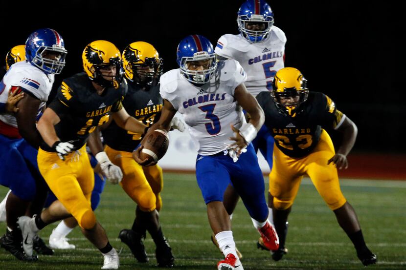 South Garland RB Jaquarion Turner (3) navigates through a group of Garland defenders for a...