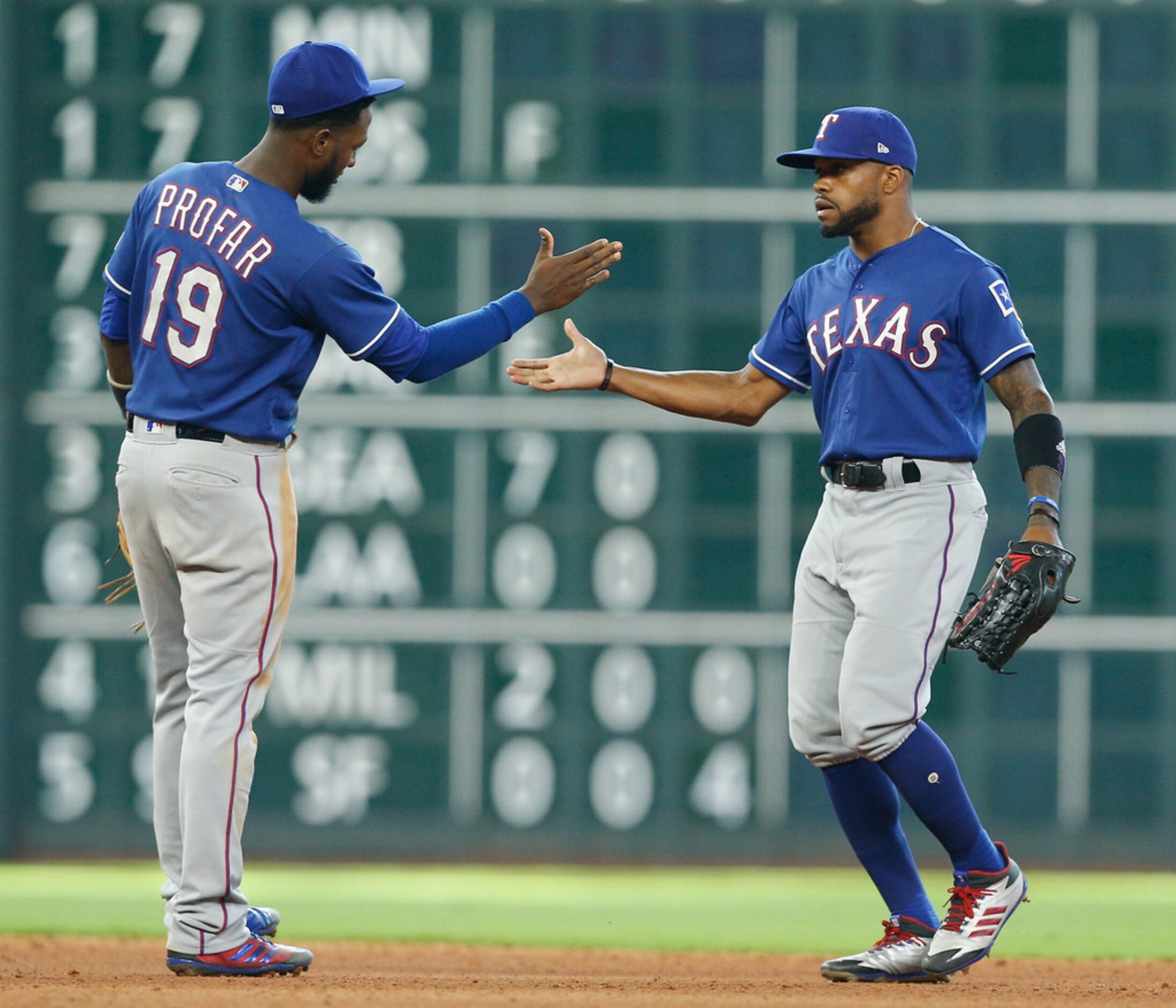 HOUSTON, TX - JULY 29:  Jurickson Profar #19 of the Texas Rangers shakes hands with Delino...