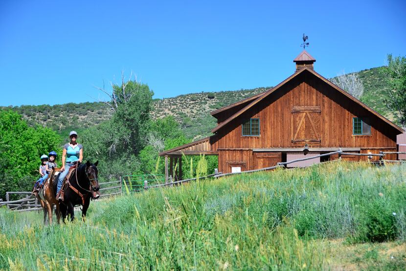 Guests leave the barn for a trail ride at Smith Fork Ranch. 
