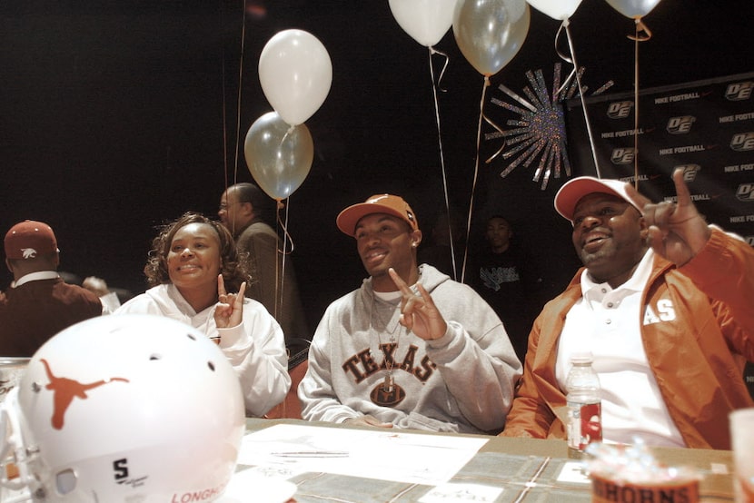 2-3-10-10 -- DeSoto's Darius Terrell (center) flashes the UT sign with his mother Sharon...