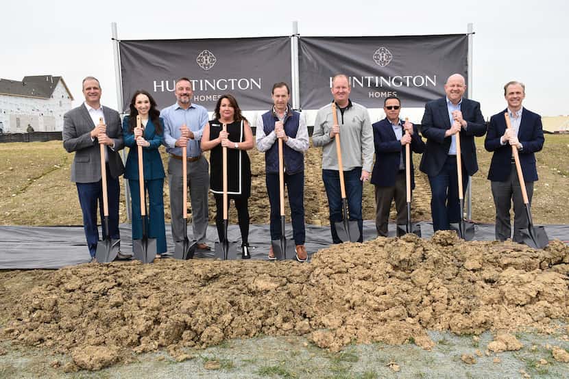 Celebrating the groundbreaking of a new model home in Fields are (from left): Jason Walker,...