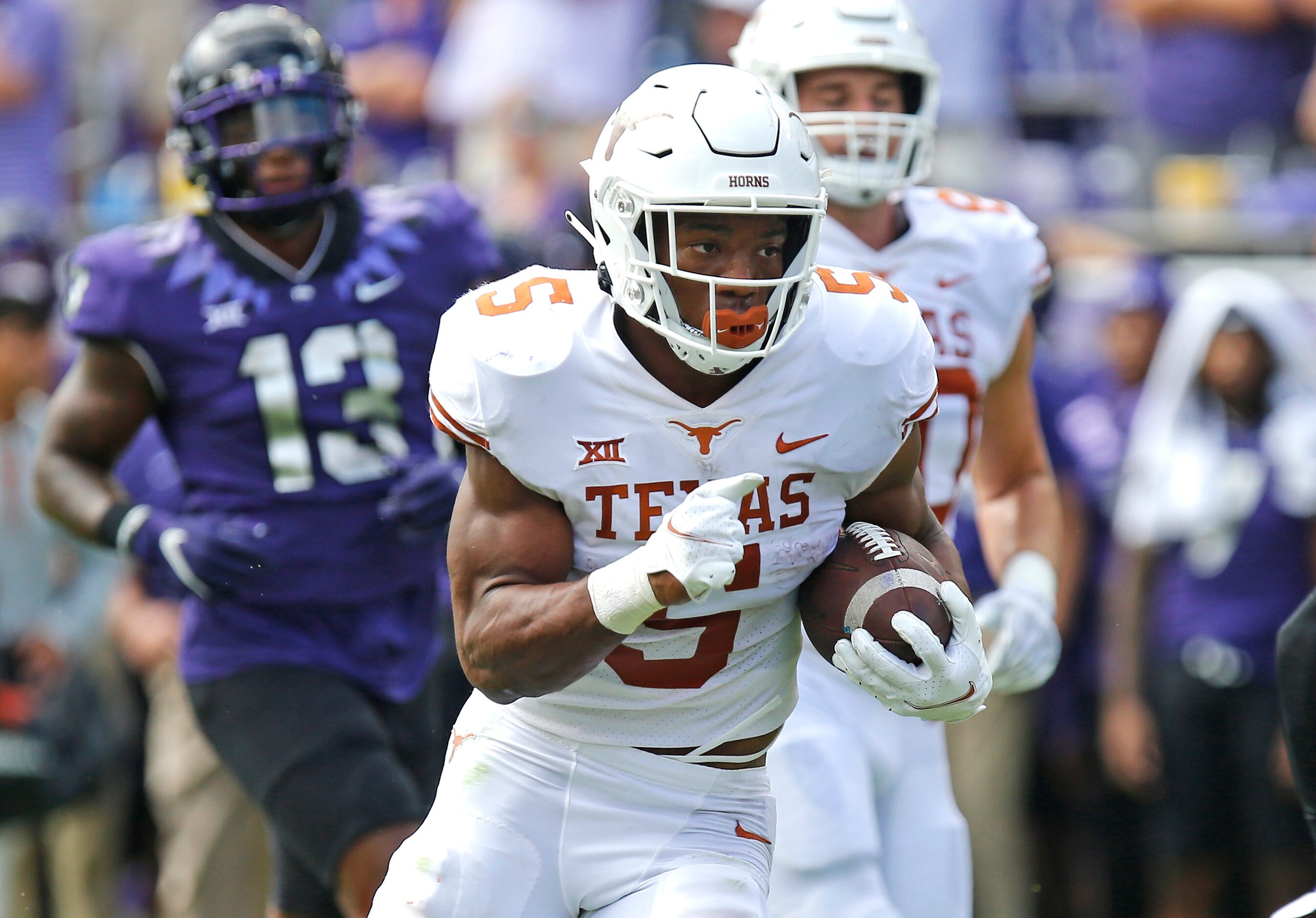 Texas Longhorns running back Bijan Robinson (5) scores a touchdown during the first half as...