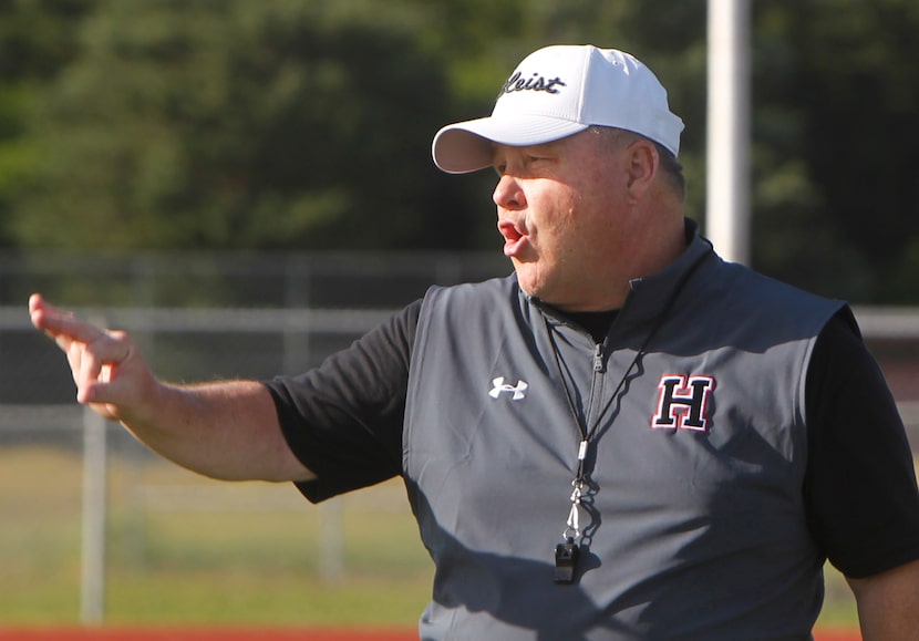 Rockwell-Heath head football coach Rodney Webb directs his players during the team's spring...