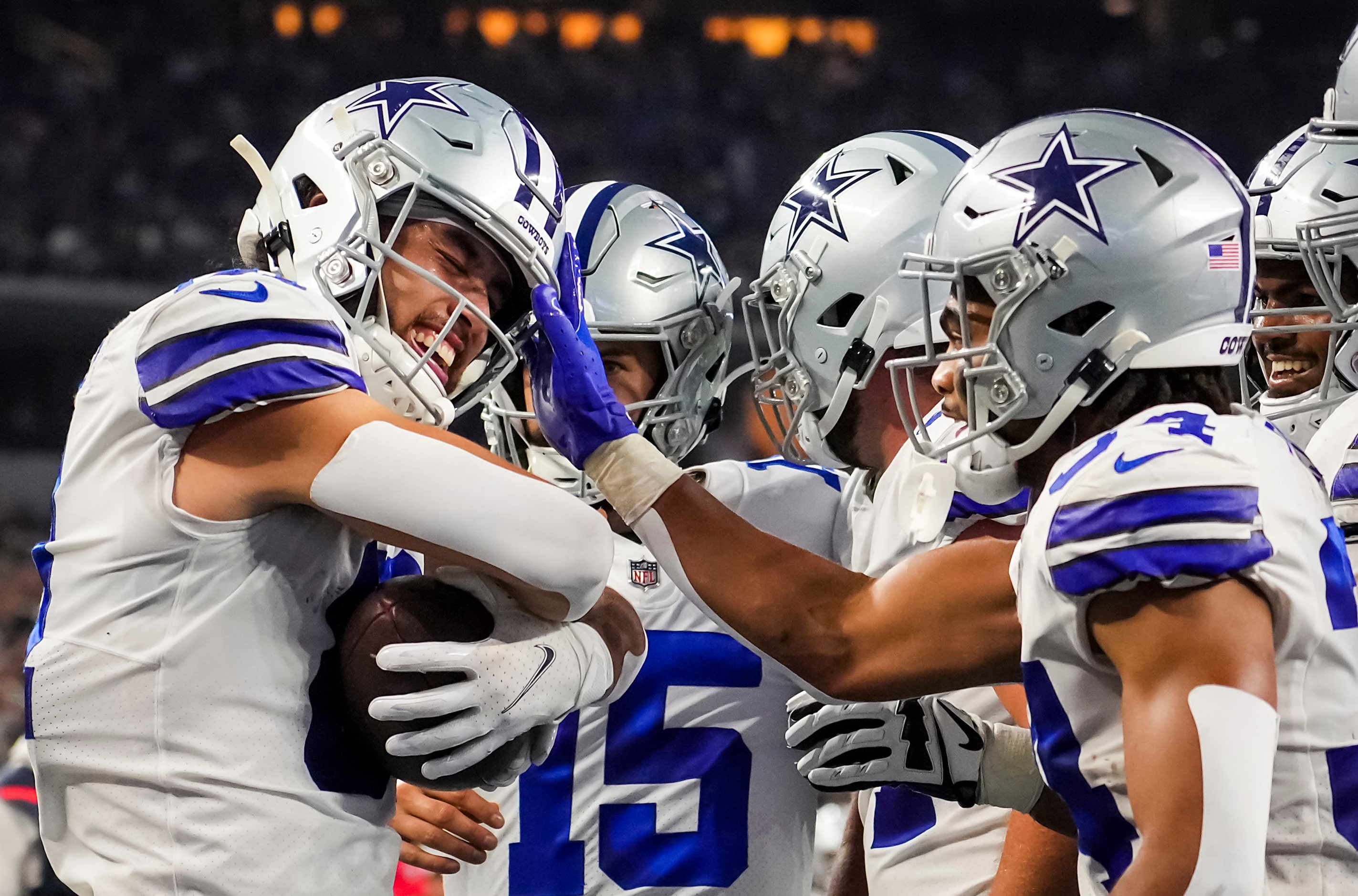 Dallas Cowboys wide receiver Simi Fehoko (81) celebrates with quarterback Will Grier (15)...