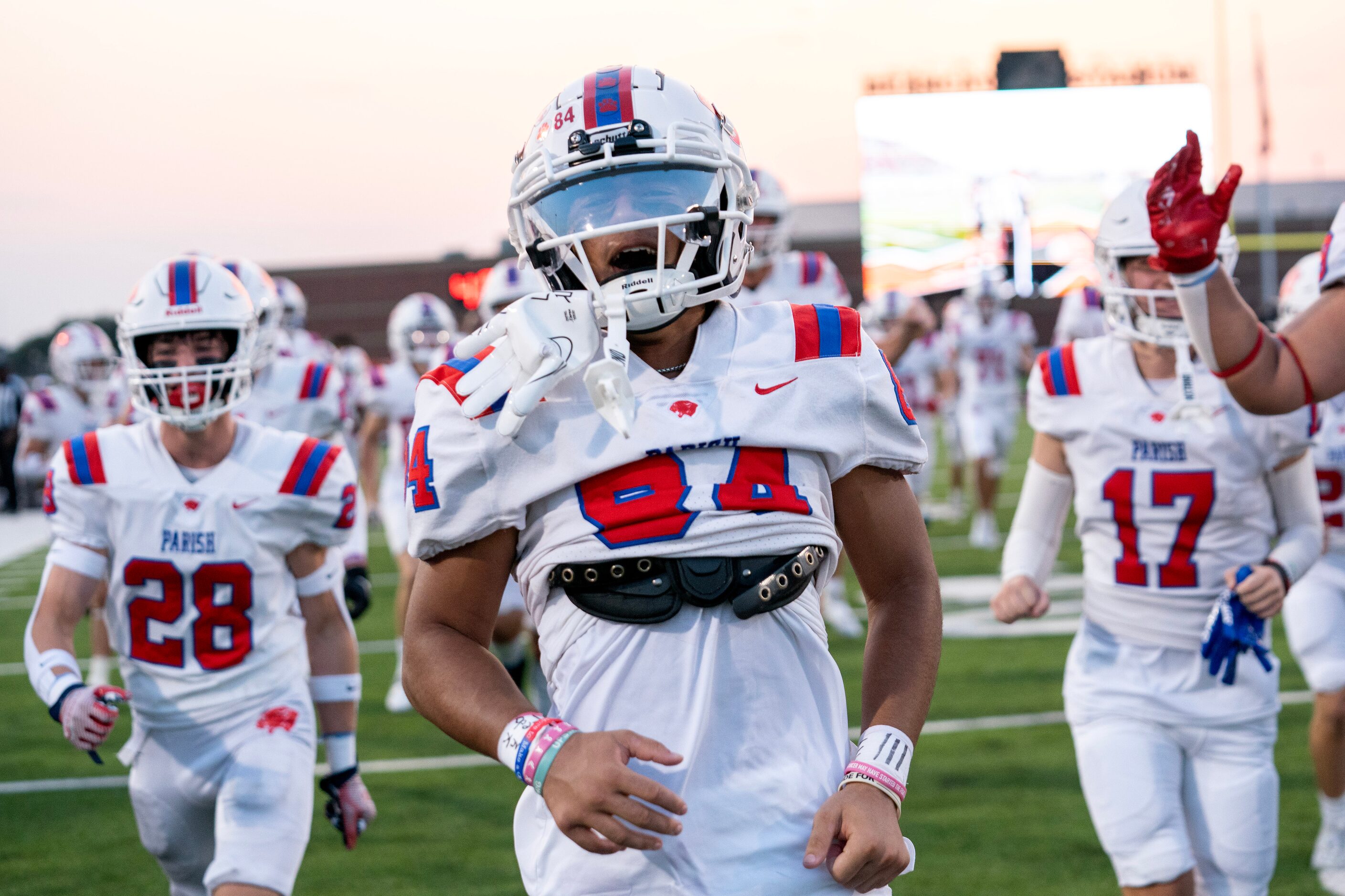 Parish Episcopal sophomore wide receiver Marcus Hanish (84) takes the field with his team...