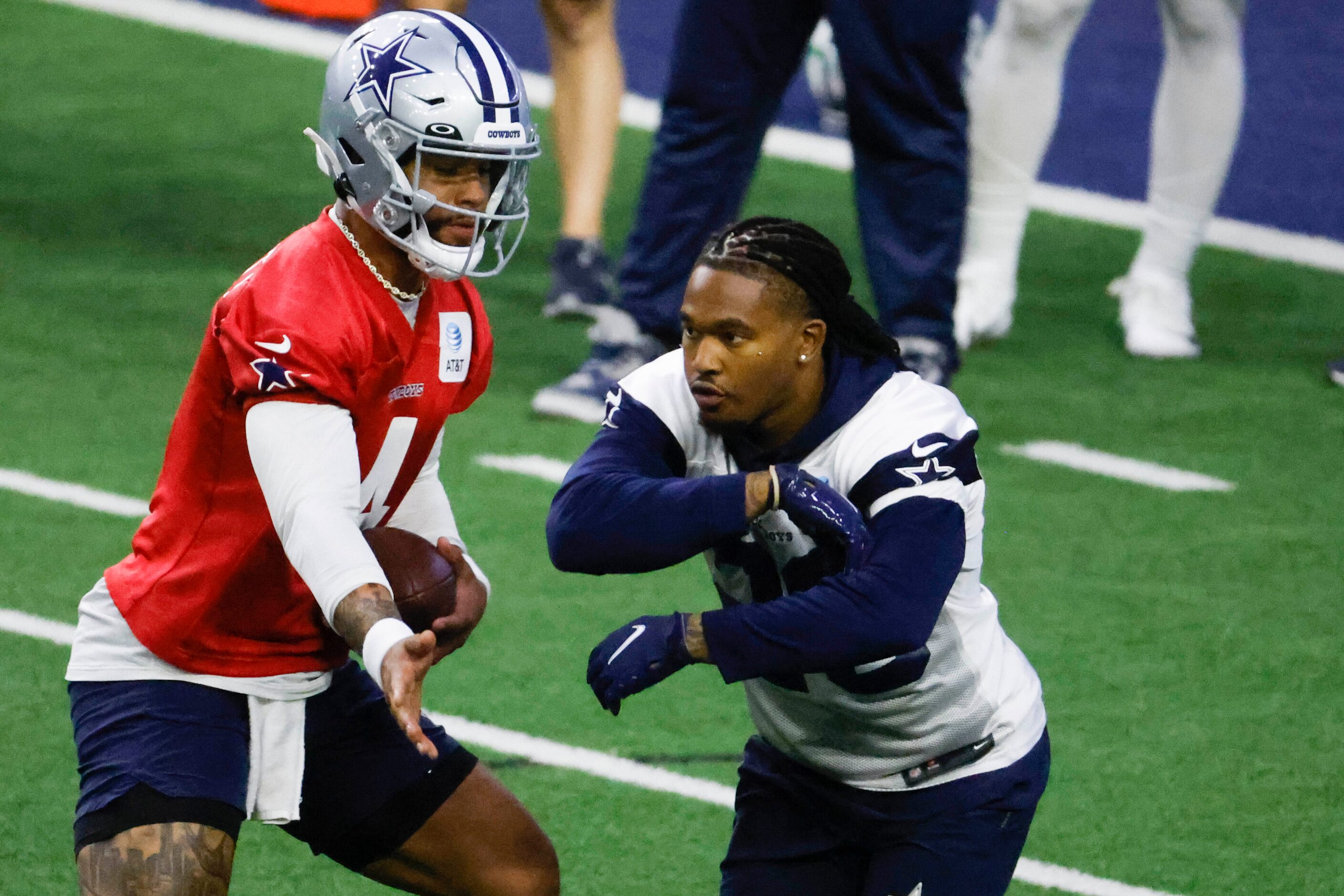 Dallas Cowboys quarterback Dak Prescott (4) fakes a hand off to Dallas Cowboys safety...