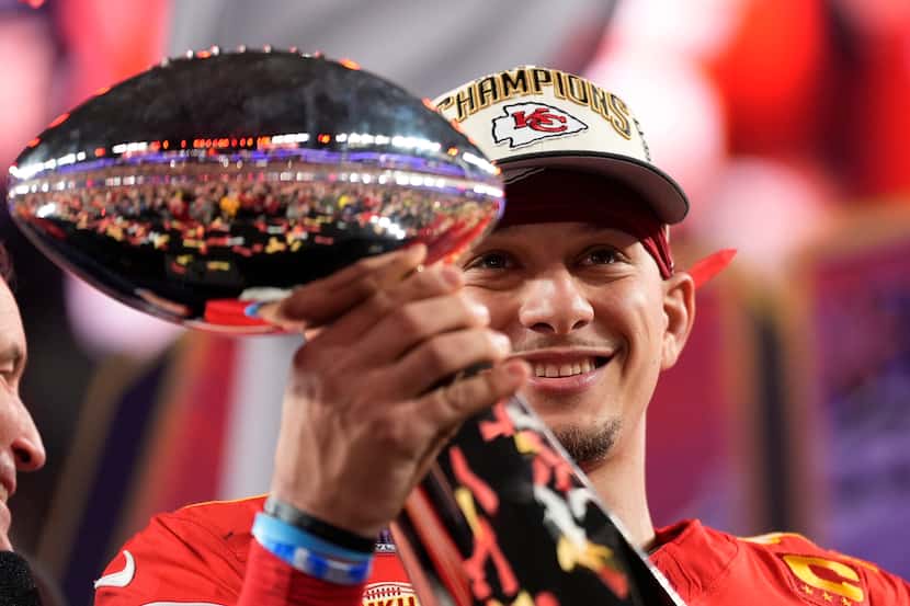 Kansas City Chiefs quarterback Patrick Mahomes holds the Vince Lombardi Trophy after the NFL...