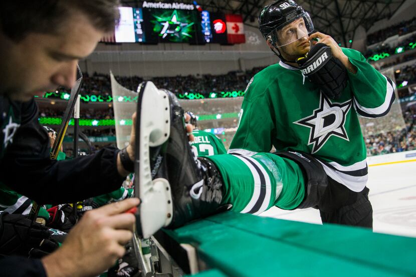 Dallas Stars center Jason Spezza (90) has his skate looked at during the second period of...