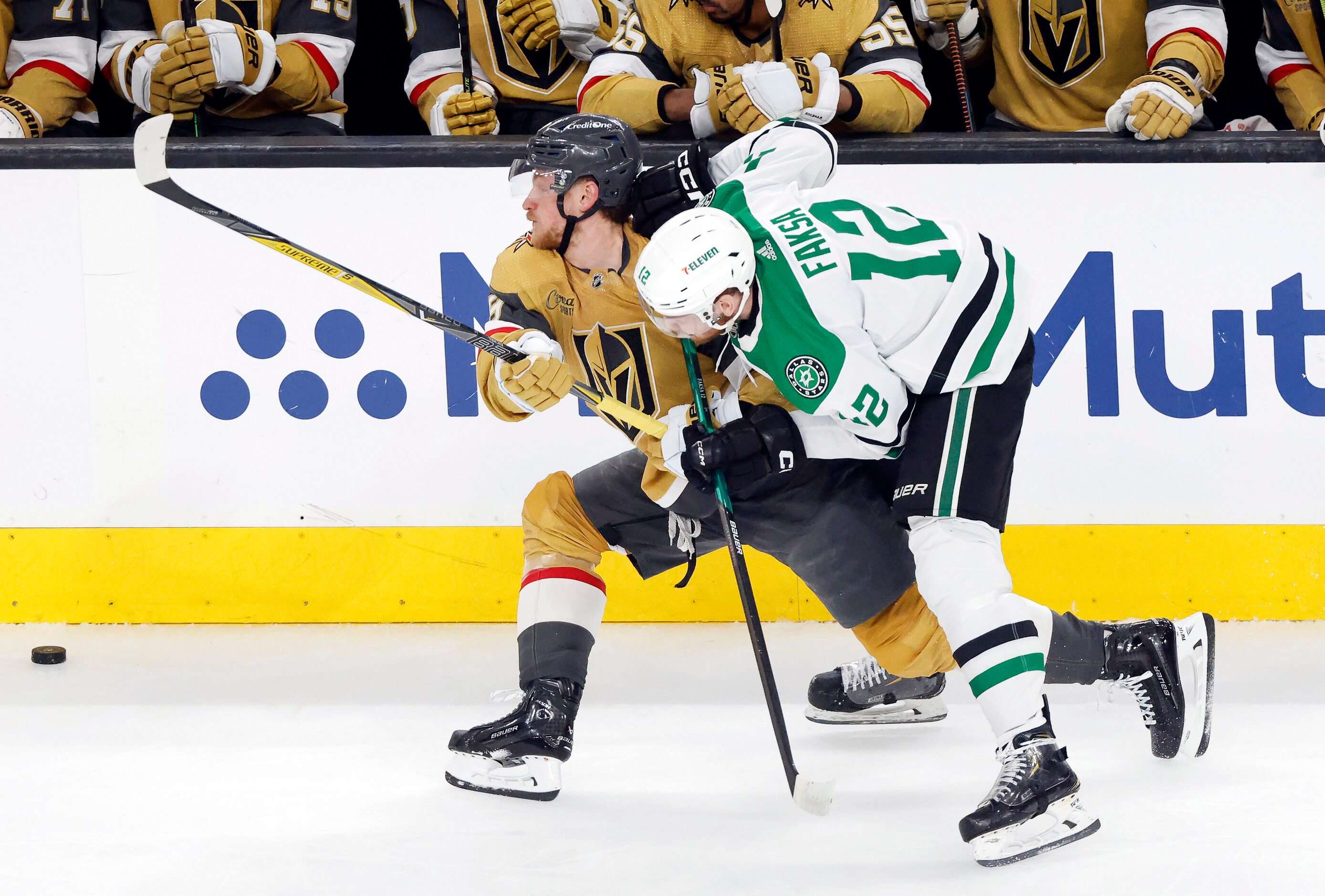 Dallas Stars center Radek Faksa (12) and Vegas Golden Knights center Jack Eichel (9) battle...