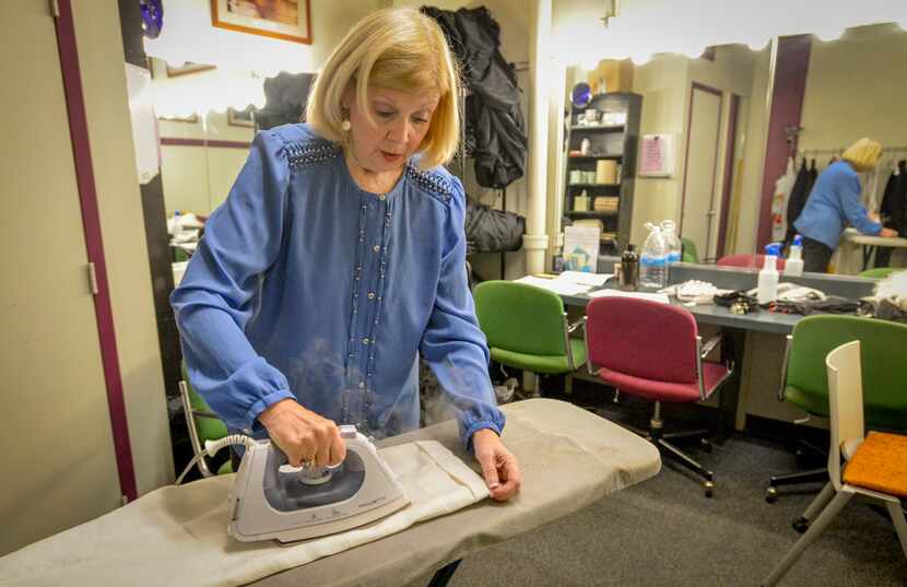 WingSpan's Susan Sargeant irons a pair of pants for an actress before a performance of On...