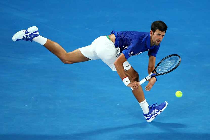 MELBOURNE, AUSTRALIA - JANUARY 17: Novak Djokovic of Serbia plays a backhand during his...