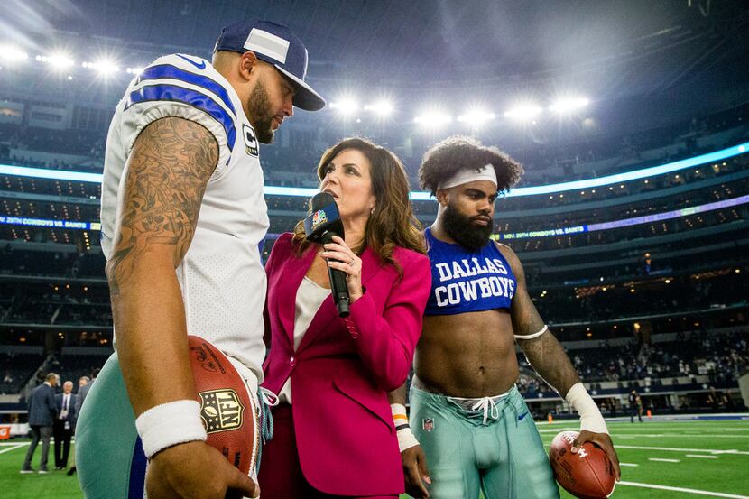 Sunday Night Football sideline reporter Michele Tafoya interviews Dallas Cowboys quarterback...