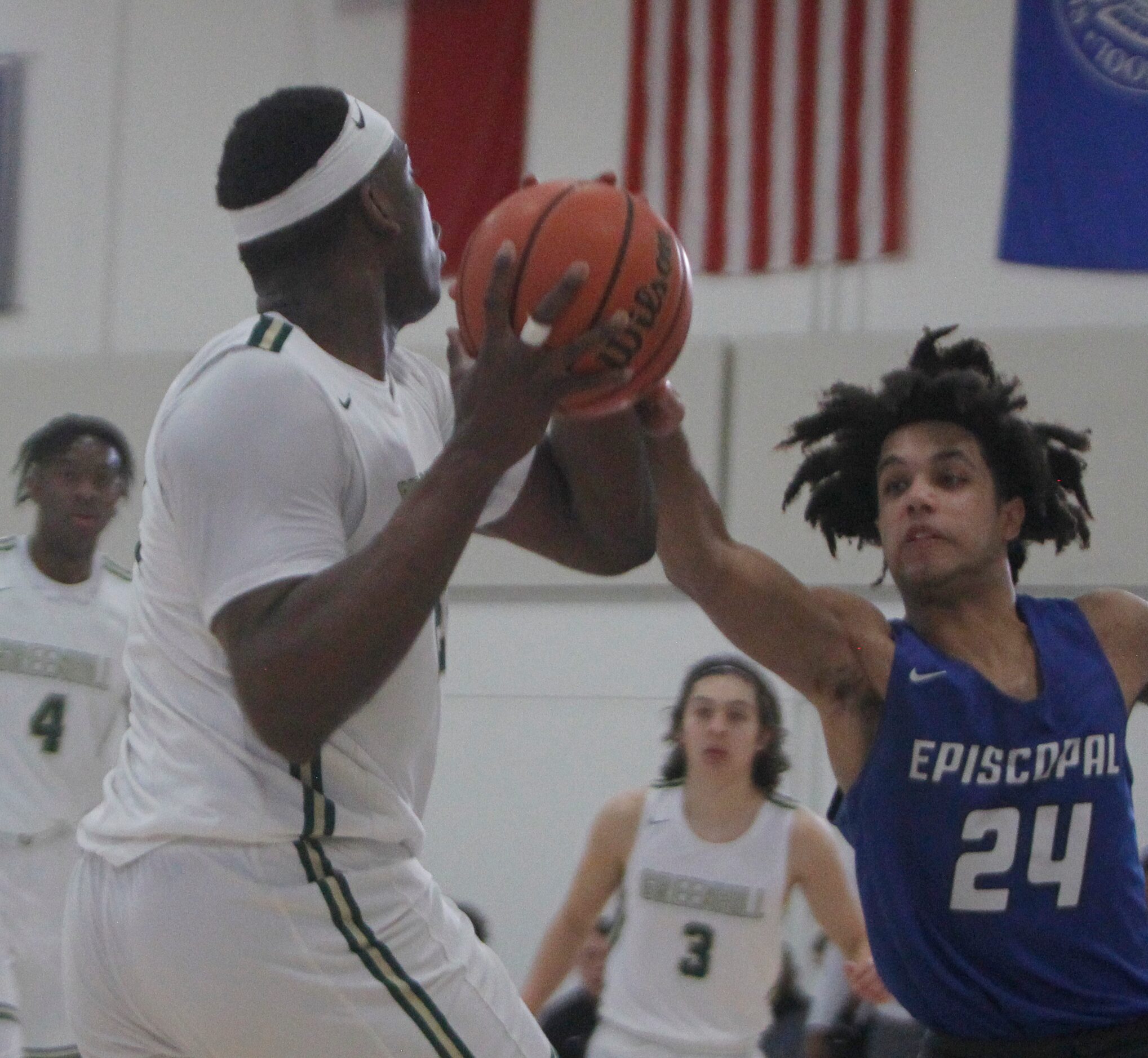 Greenville's Lee Dort (22), left, drives the baseline as Houston Episcopal's Brendan Nwamba...