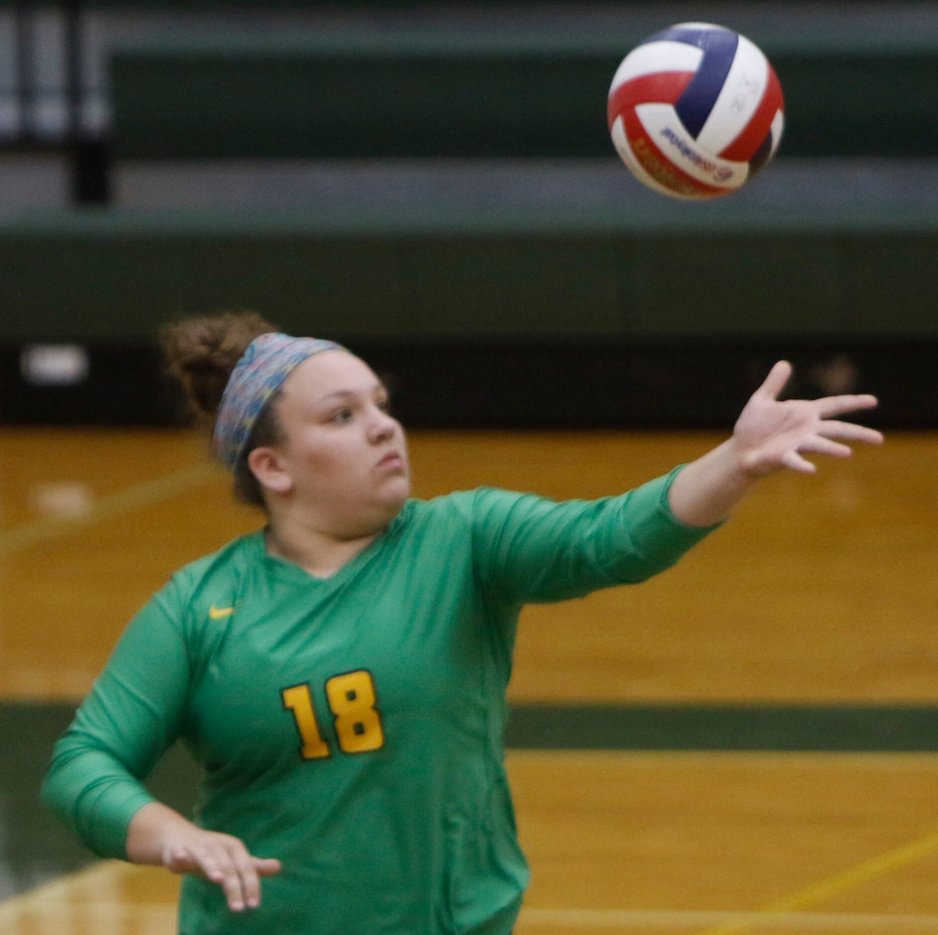 Carrollton Newman Smith's Rebecca Goldstein (18) serves during the first game of their match...