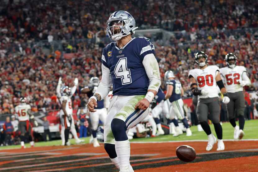 Dallas Cowboys quarterback Dak Prescott (4) celebrates his second quarter touchdown run...