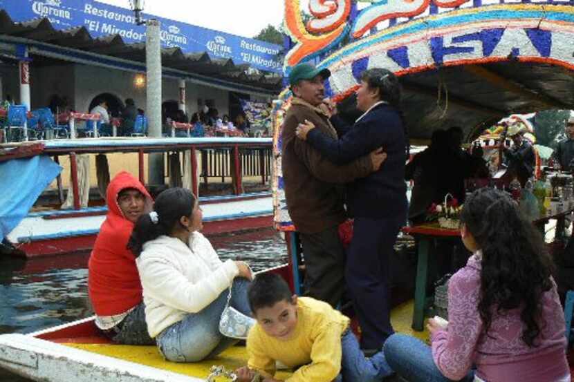  Mexican families celebrate birthdays and and anniversaries by renting wooden boats that...