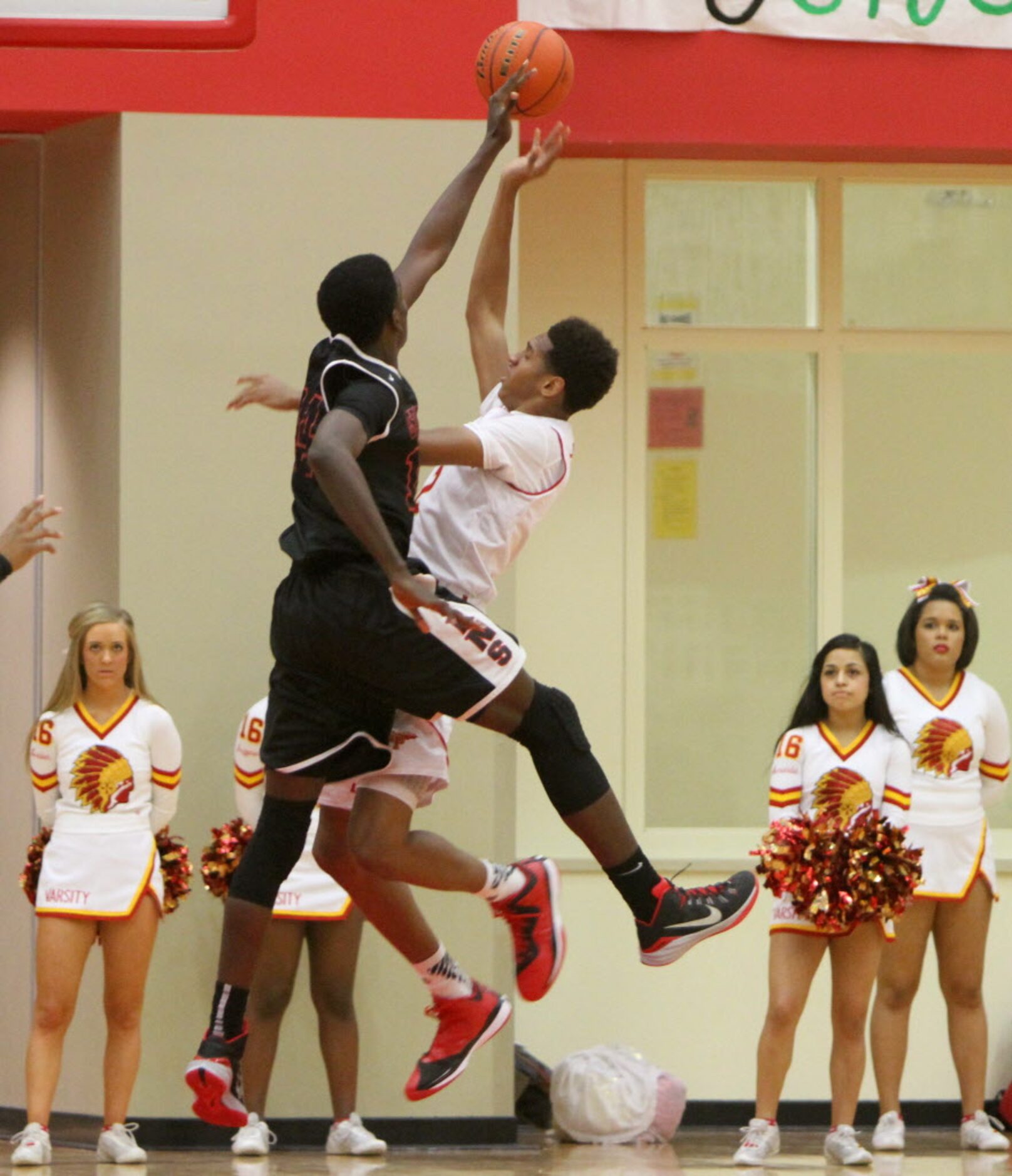 Cedar Hill forward Darhon Mitchell (14) goes high to block a shot by South Grand Prairie...