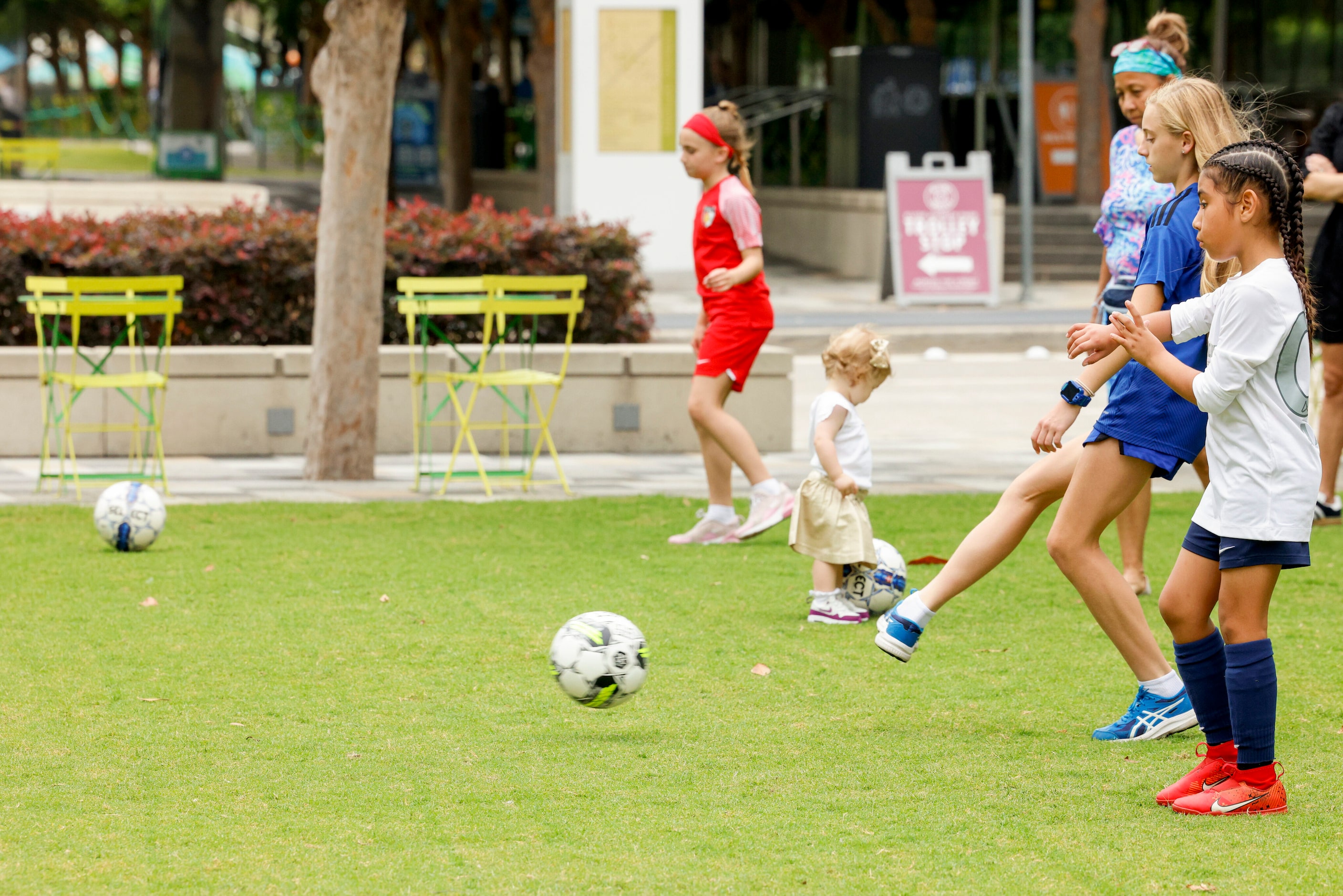 Children play soccer before the team name for the USL Super League Dallas franchise was...