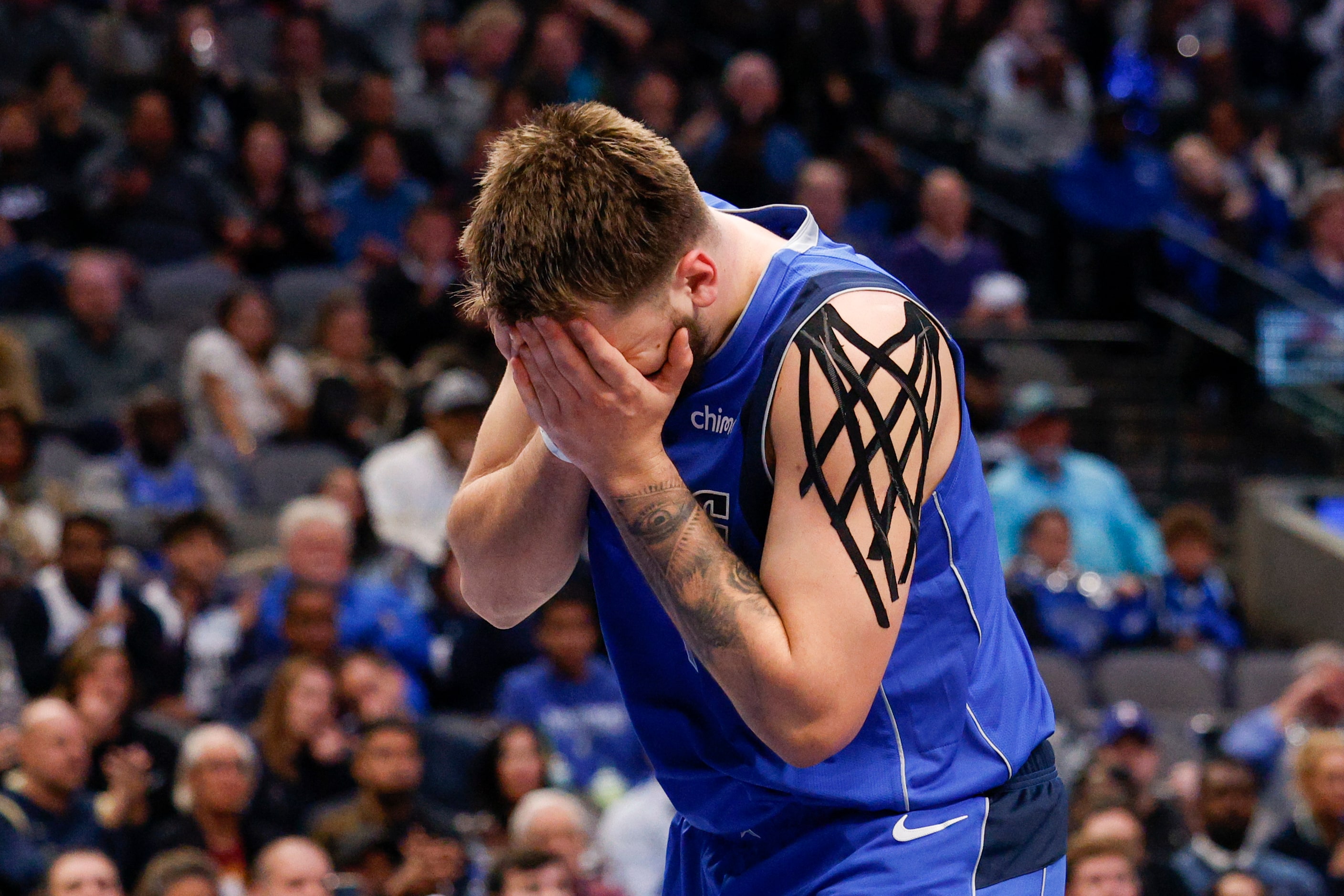 Dallas Mavericks guard Luka Doncic (77) reacts after being called for a foul during the...