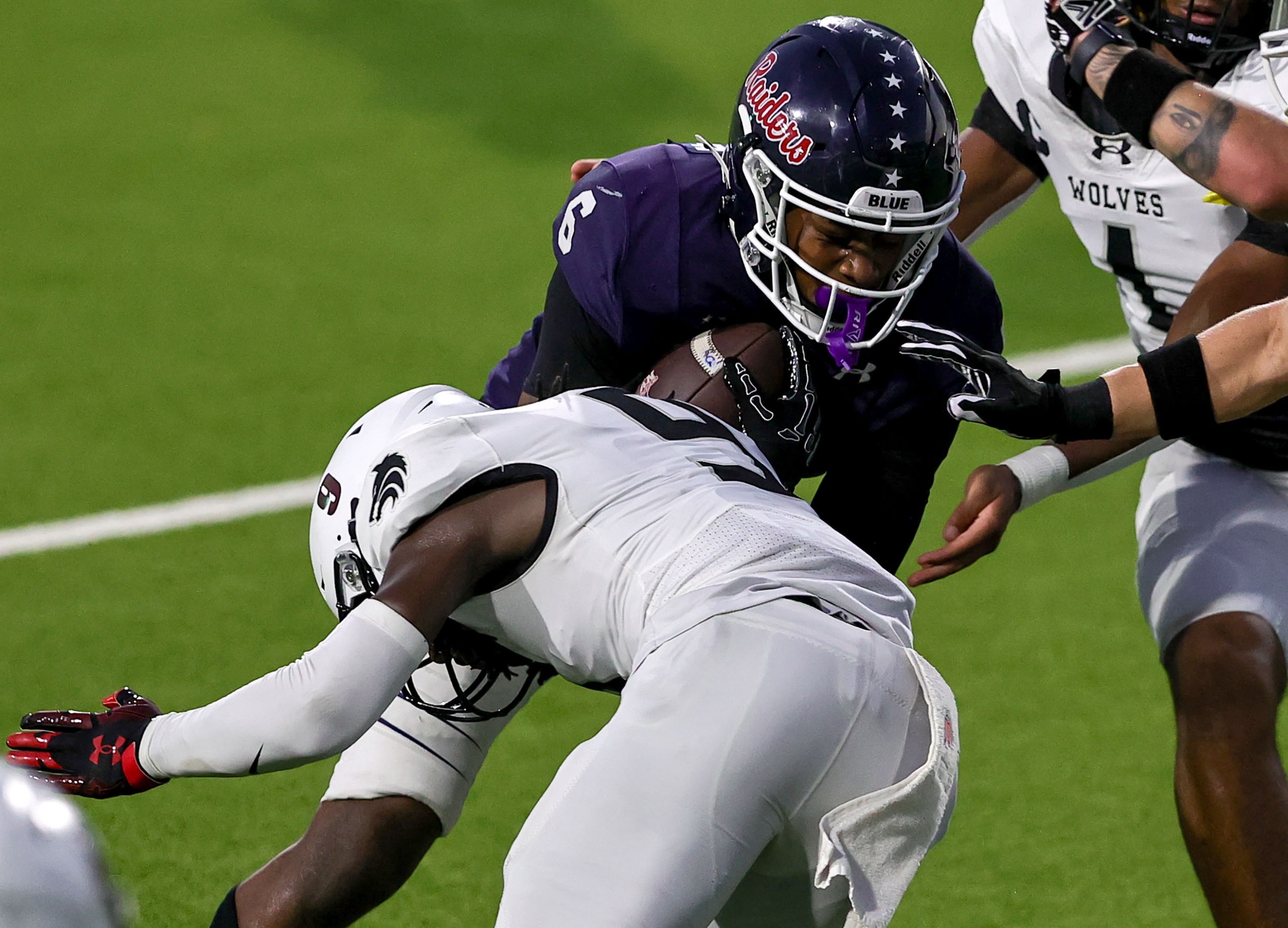 Denton Ryan running back Nemo Warmate (6) is hit hard by Mansfield Timberview safety Nathan...