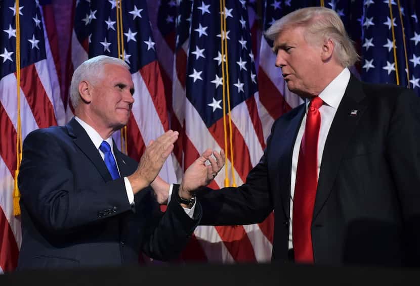 Donald Trump and his running mate Mike Pence celebrate on election night at the New York...