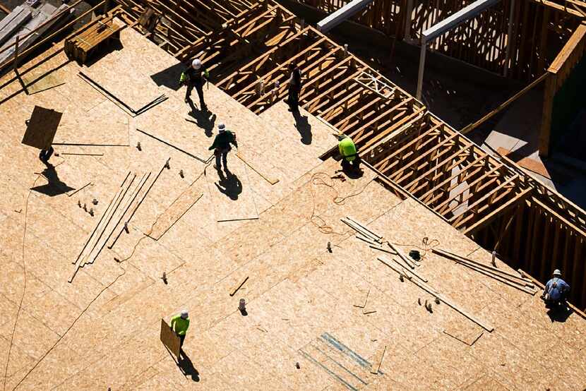 Construction on apartments in the Palisades Central project in Richardson is seen in an...