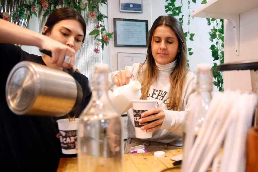 Owner Giuliana Bernini (right) prepares coffee orders with barista Kristen Branson at The...
